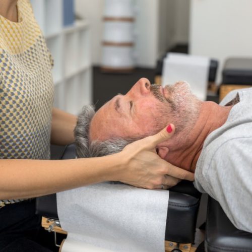 Man having osteopathic treatment on his neck